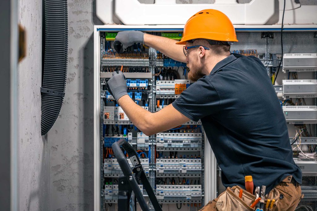 electrician working switchboard